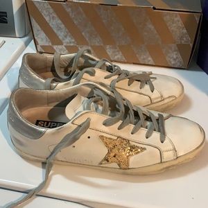 Golden goose leather sneakers with gold glittery star